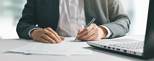 Business man signing documents